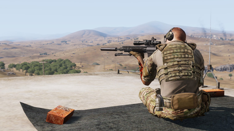A soldier with a sniper rifle provides overwatch on a rooftoop.