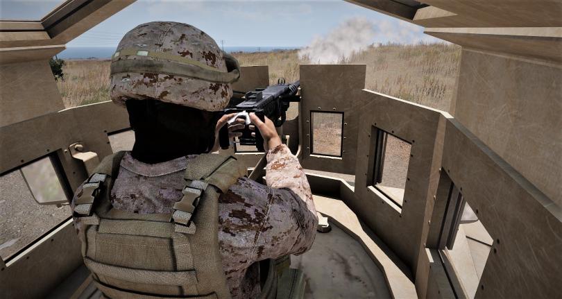 A marine firing a heavy machine gun.